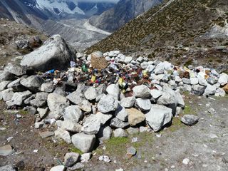 A walled landfill near the village at Dughla, a glacial lake in Sagarmatha National Park: Once landfills are full, the garbage is burned then buried.