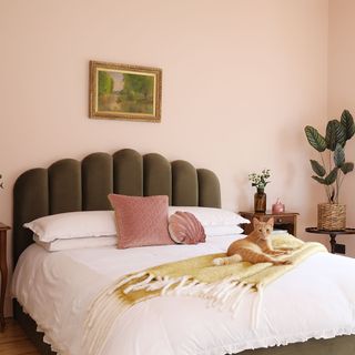 Pink bedroom with green headboard