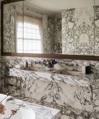 Maximalist bathroom by Shalini Misra with veined marble