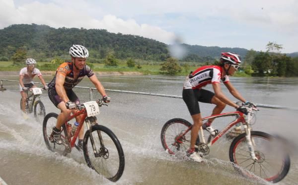 Two racers ride through the water