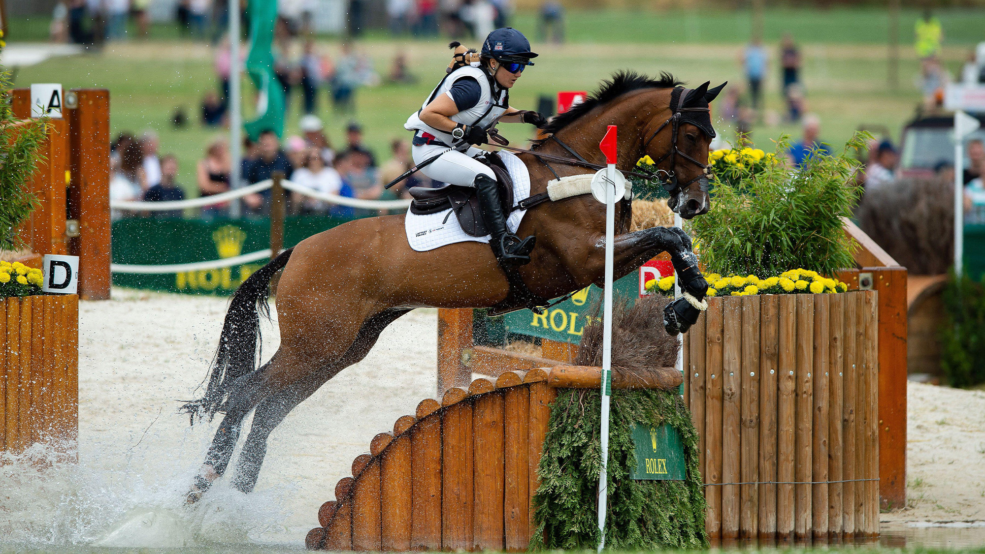 Laura Collett riding London 52 on Aachen cross-country course, jumping a fence out of water