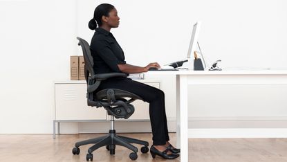 Correct sitting posture can help avoid back issues and pain