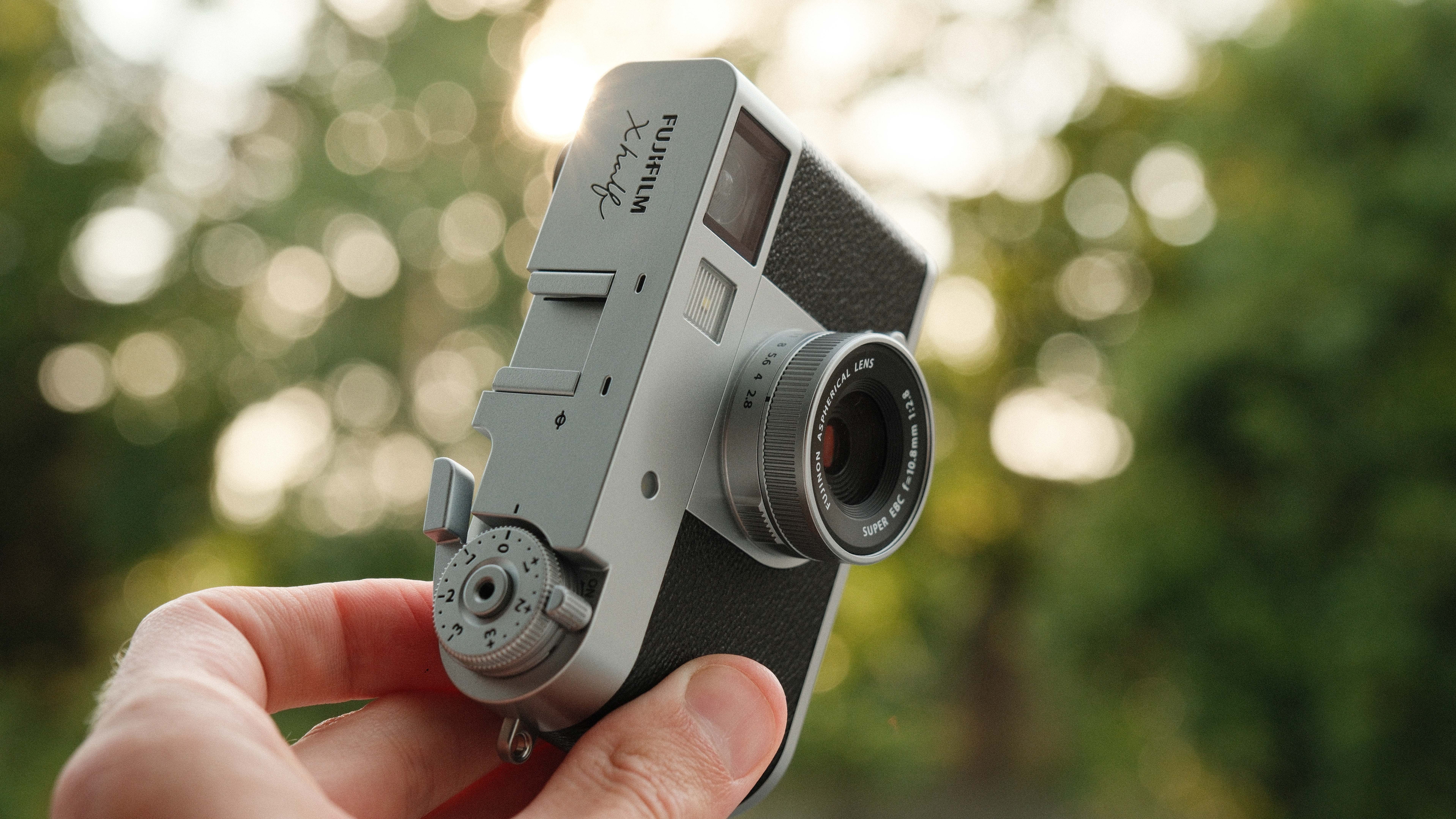 Fujifilm X Half camera held in a hand