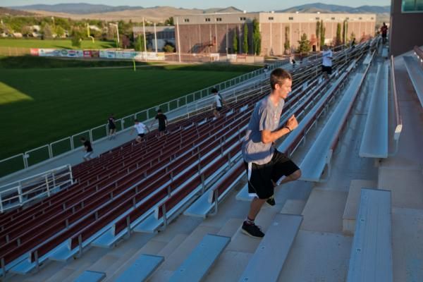 Andrew Dillman runs the stairs at Carroll College during USA Cycling&rsquo;s Cyclocross summer training camp in Helena, Montana