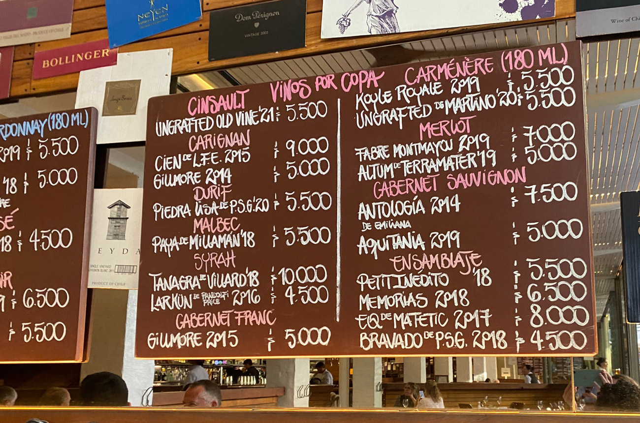 a chalk board with a list of wines