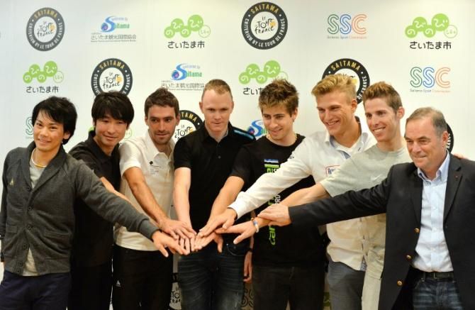 Yukira Arashiro, Fumi Beppu, Christophe Riblon, Chris Froome, Peter Sagan, Marcel Kittel and Rui Costa pose with Bernard Hinault at the Saitama Criterium.