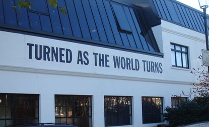 Lawrence Weiner’s ’Turned As The World Turns’ on the building’s façade