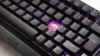 Close-up of exposed switch on Razer BlackWidow V4 Pro 75% with RGB lighting on