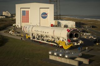 Orbital ATK's Antares rocket, with the Cygnus spacecraft onboard, rolls out of the Horizontal Integration Facility at NASA's Wallops Flight Facility in Virginia on Thursday (Oct. 13), beginning its half-mile journey to the launch pad.