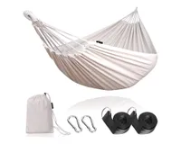 A white cotton hammock with hanging equipment