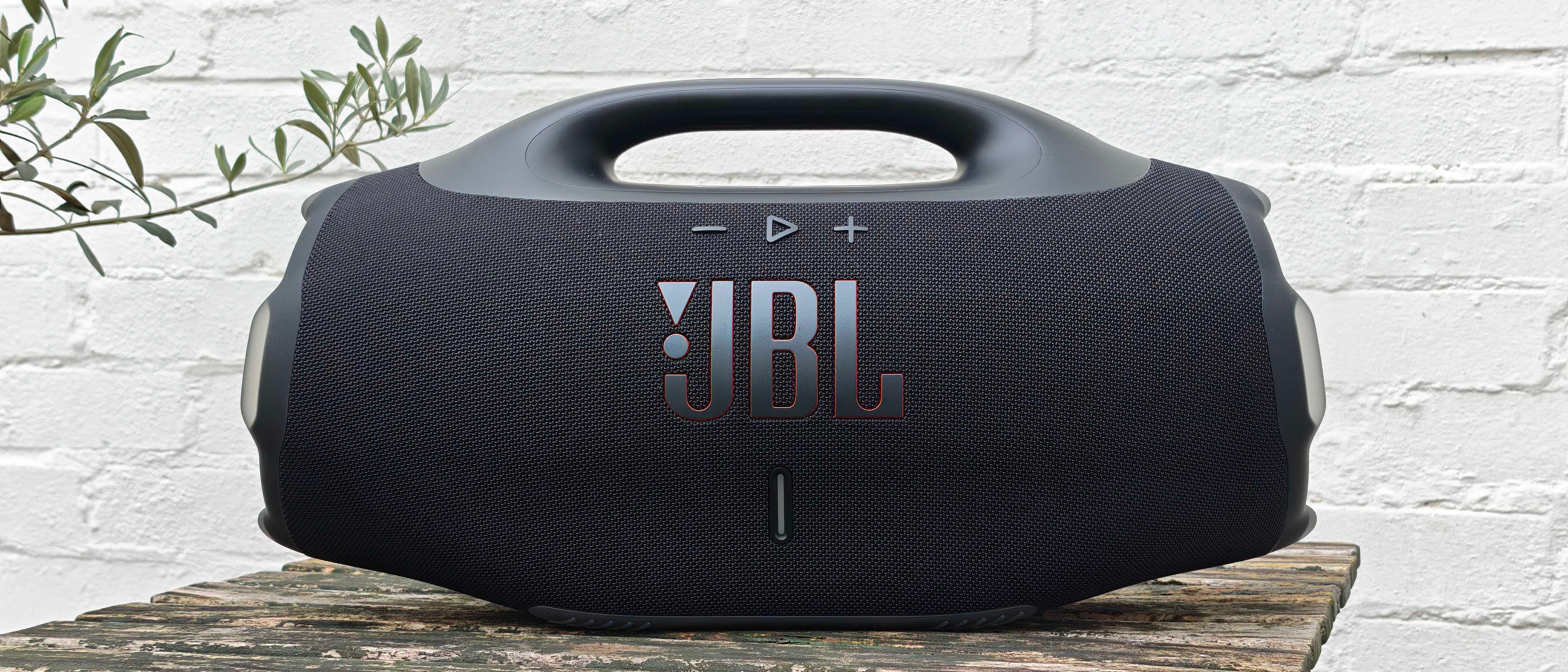 JBL Boombox 4 outdoors on a wooden table