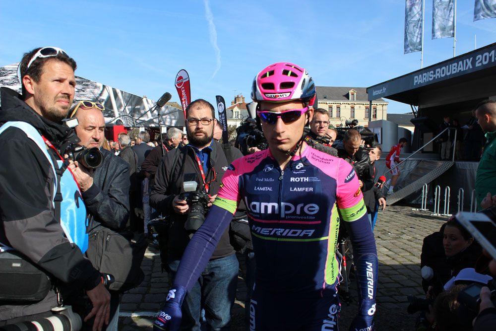 Nicolo Bonifazio opts for the tricky task of walking to sign on in cleats