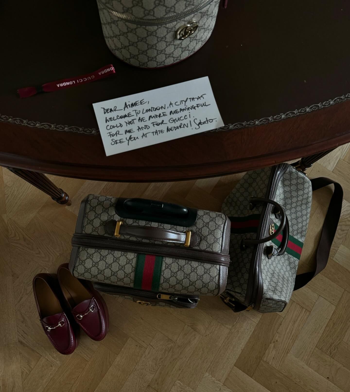 Gucci luggage and duffle aerial shot.