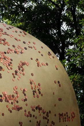 Upclose image of the magnetic installation showing multiple copper coins placed on it