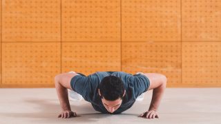 Man performs press-up bodyweight exercise