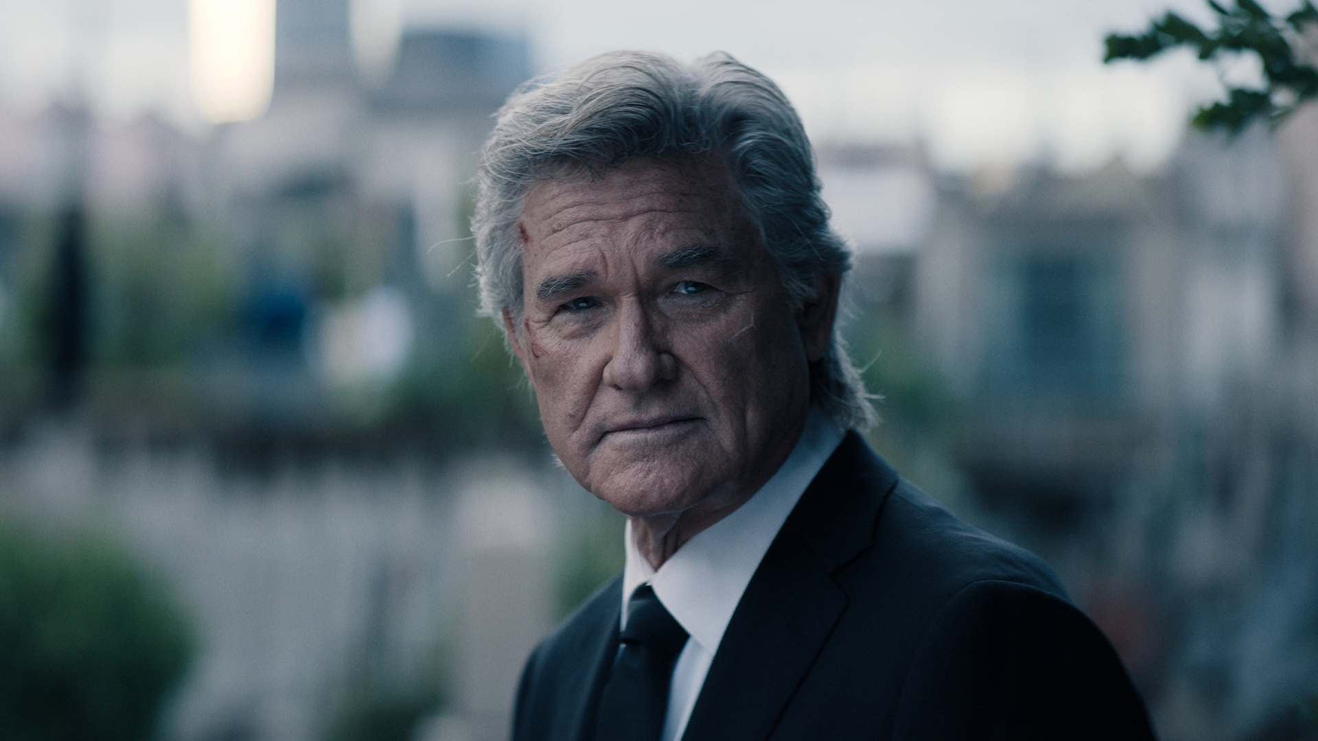 Lee Shaw looking at someone standing off-camera in Monarch: Legacy of Monsters season 2 episode 6