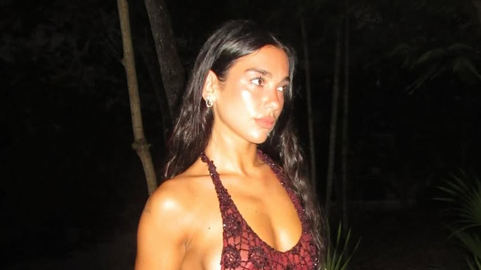 Dua Lipa wears a red lace crochet dress and celebrates her birthday