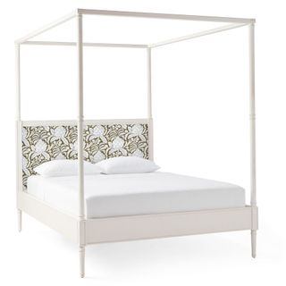 A white four poster bed frame