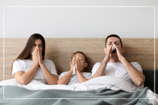 Family in bed with a cough