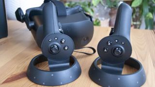HP Reverb G2 VR headset and controllers on a wooden desk