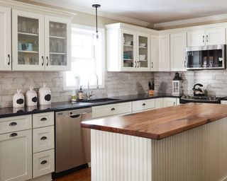 White kitchen with wooden island