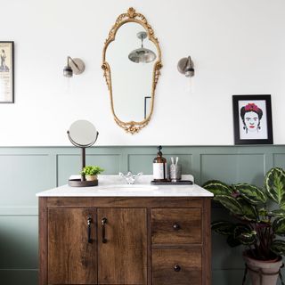 bathroom makeover with vintage mirror and wooden vanity