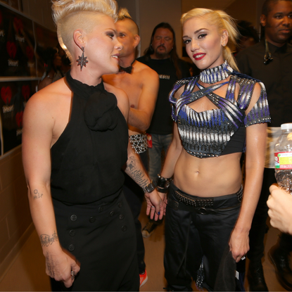 Singers Pink (L) and Gwen Stefani of No Doubt pose backstage during the 2012 iHeartRadio Music Festival at the MGM Grand Garden Arena on September 21, 2012 in Las Vegas, Nevada.