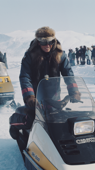 Charles, Prince of Wales on an Olympique ski-doo during a tour of the Northwest Territories of Canada, April 1975