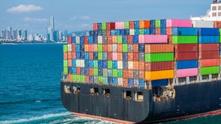 A container ship with containers at sea