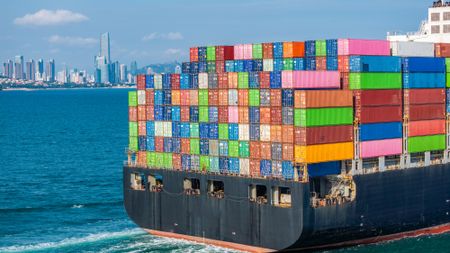 A container ship with containers at sea