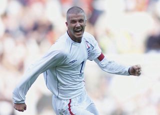 David Beckham celebrates after scoring a free-kick against Greece to seal England's qualification for the 2002 World Cup.