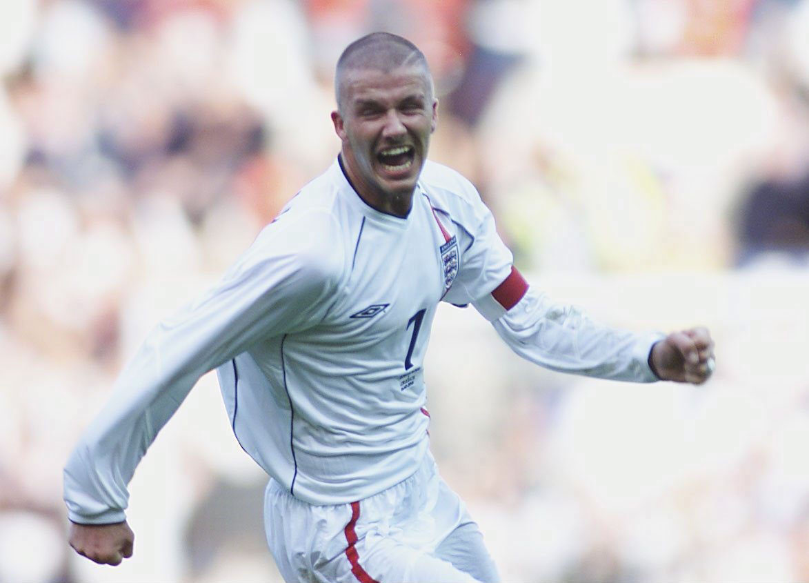 David Beckham celebrates after scoring a free-kick against Greece to seal England's qualification for the 2002 World Cup.