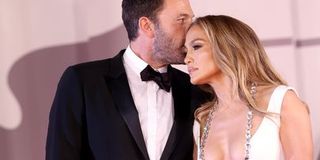 Ben Affleck leans in to say something to Jennifer Lopez