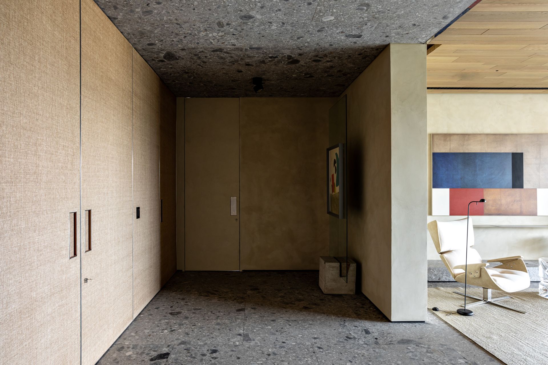 an entryway with floor to ceiling screened doors