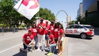 News Director Art Holliday waves the KSDK flag with his newsroom colleagues at the 2023 Annie Malone Parade. 