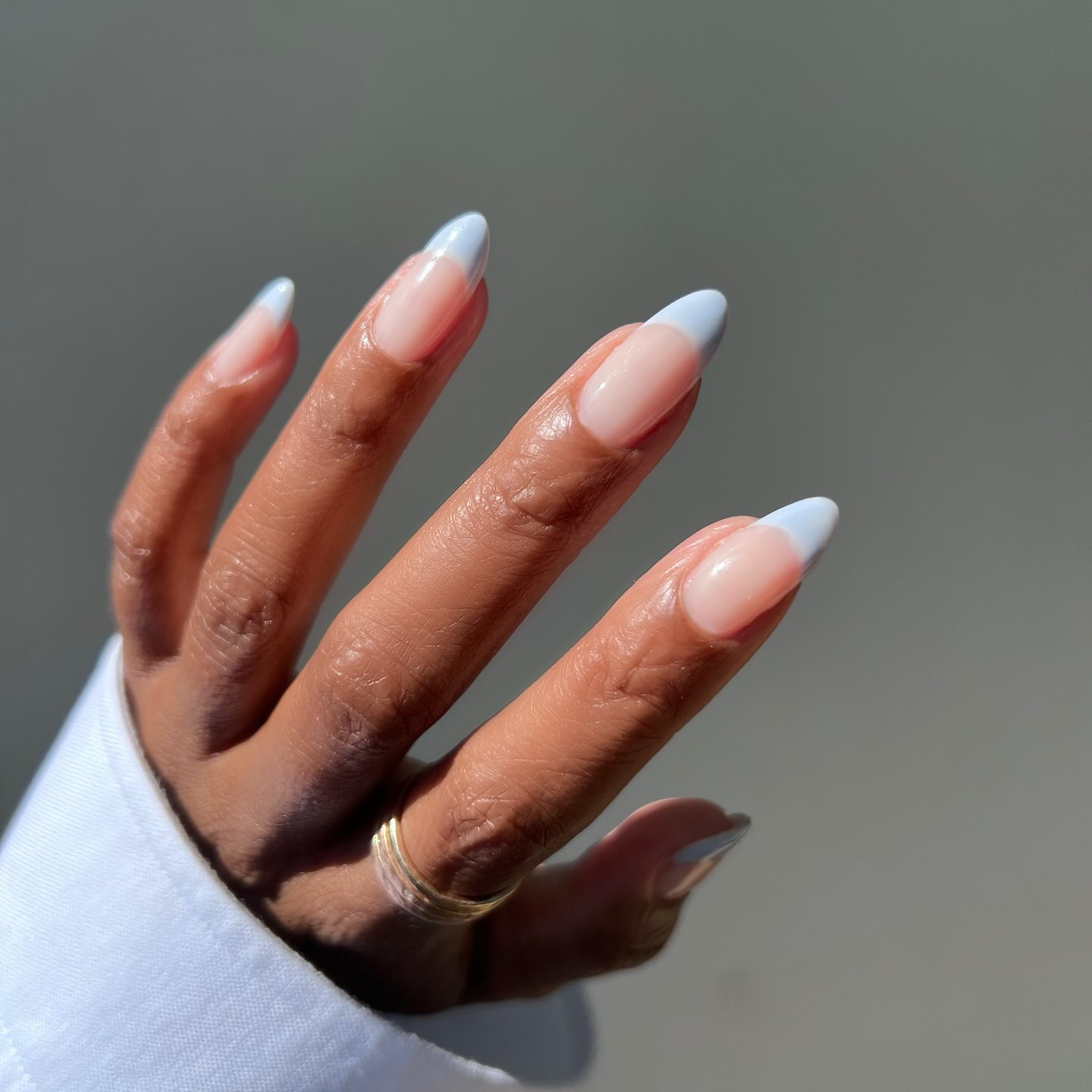 A baby blue french manicure by The Mani Club