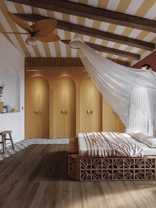 A large bedroom with yellow painted ceiling and a whimsical bed design