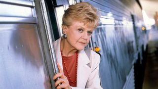 Angela Lansbury leans out of a train in Murder, She Wrote