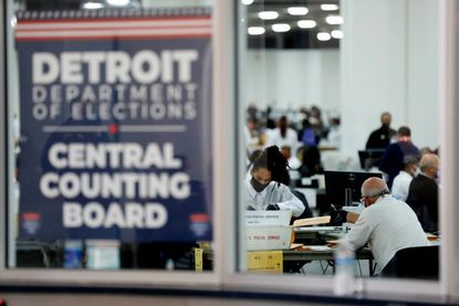 People count ballots in Detroit.