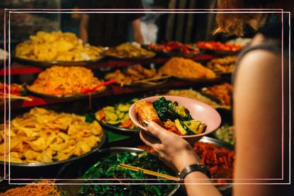 A woman eating Thai food, one of the healthiest diets in the world