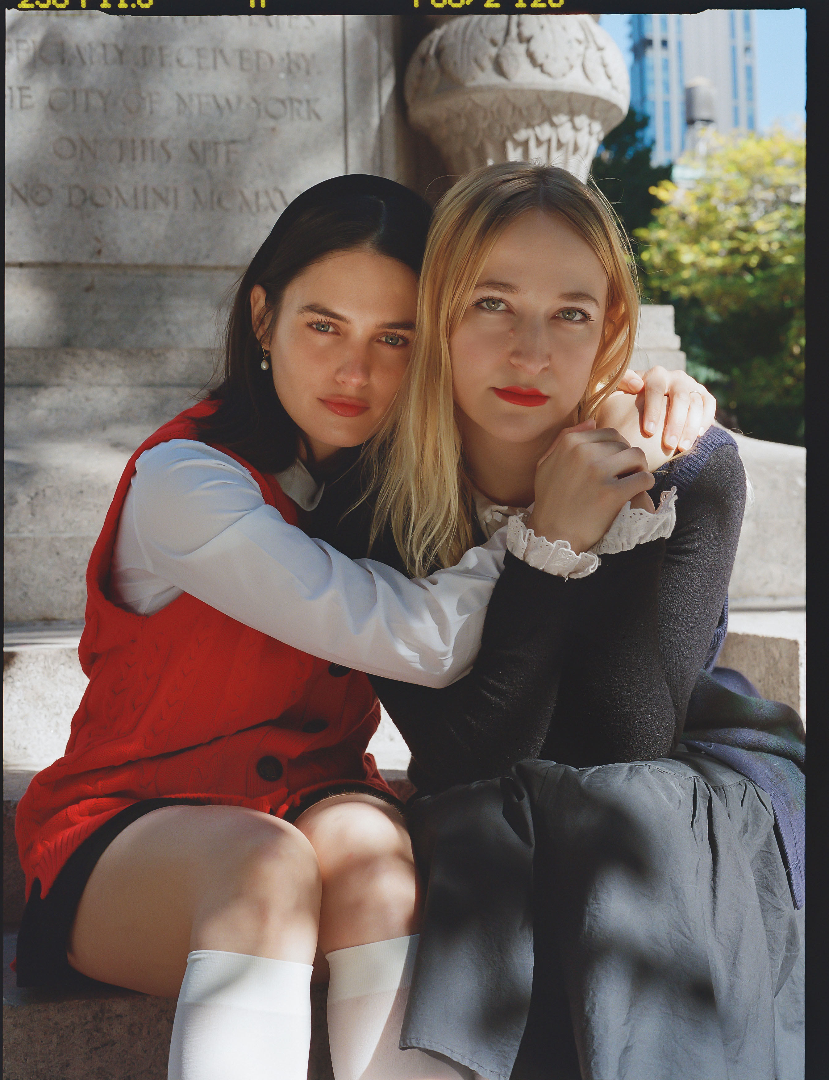 forever magazine cofounders nat ruiz and anika jade levy pose together embracing in front of a new york city park statue