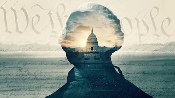 A composite silhouette of a historic figure overlaid with a view of the U.S. Capitol building at sunrise, set against a backdrop of cursive script reading "We the People."