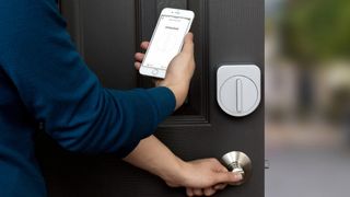 Person opening door using smart lock