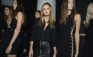 Black color dressed models at Versus Versace S/S 2015