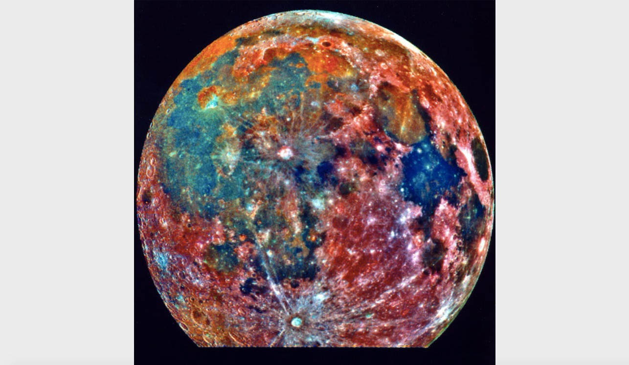 This false-color photograph is a composite of 15 images of the moon taken through three color filters by NASA’s Galileo Jupiter probe during the spacecraft's passage through the Earth-moon system on Dec. 8, 1992. Areas appearing red generally correspond to the lunar highlands, while blue to orange shades indicate the ancient volcanic lava flow of a mare, or lunar sea. Bluer mare areas contain more titanium than do the orange regions.