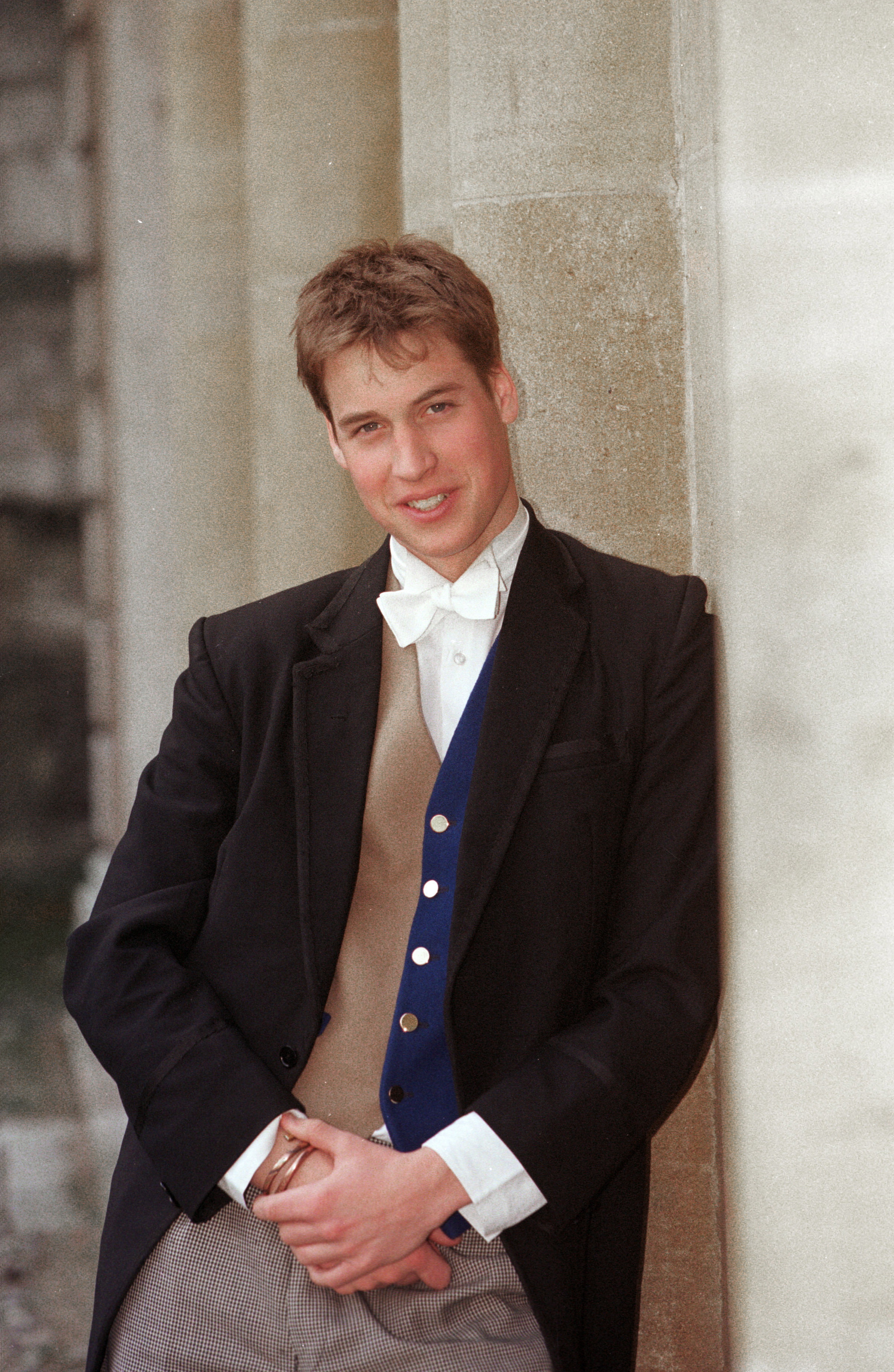 Prince William wearing a waistcoat and bow tie at Eton College in 2000