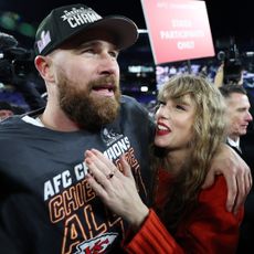 Travis Kelce and Taylor Swift celebrate the Kansas City Chiefs' victory against the Baltimore Ravens in the AFC Championship Game at M&T Bank Stadium on January 28, 2024 in Baltimore, Maryland.