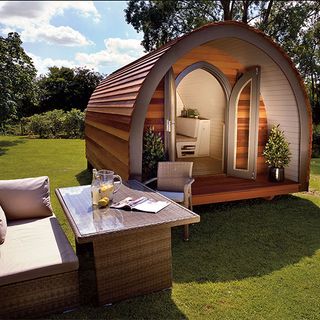 garden hideouts pod with wicker garden furniture