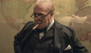 Darkest Hour Gary Oldman Winston Churchill smoking in front of a map