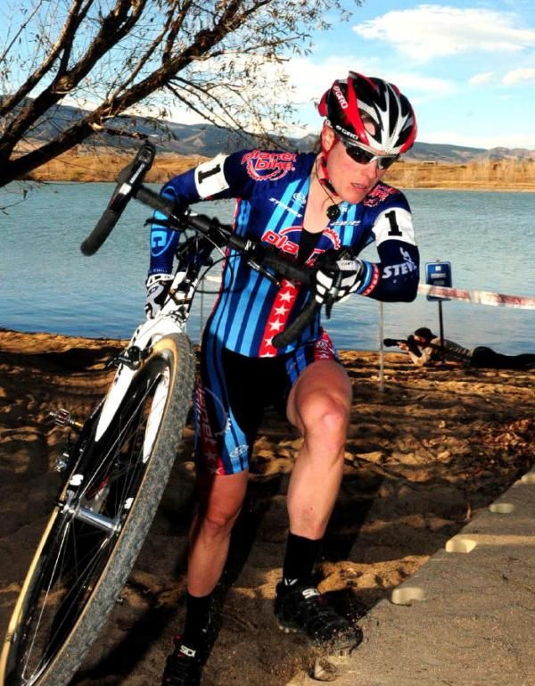 Katie Compton (Planet Bike) crossing a plastic pier.
